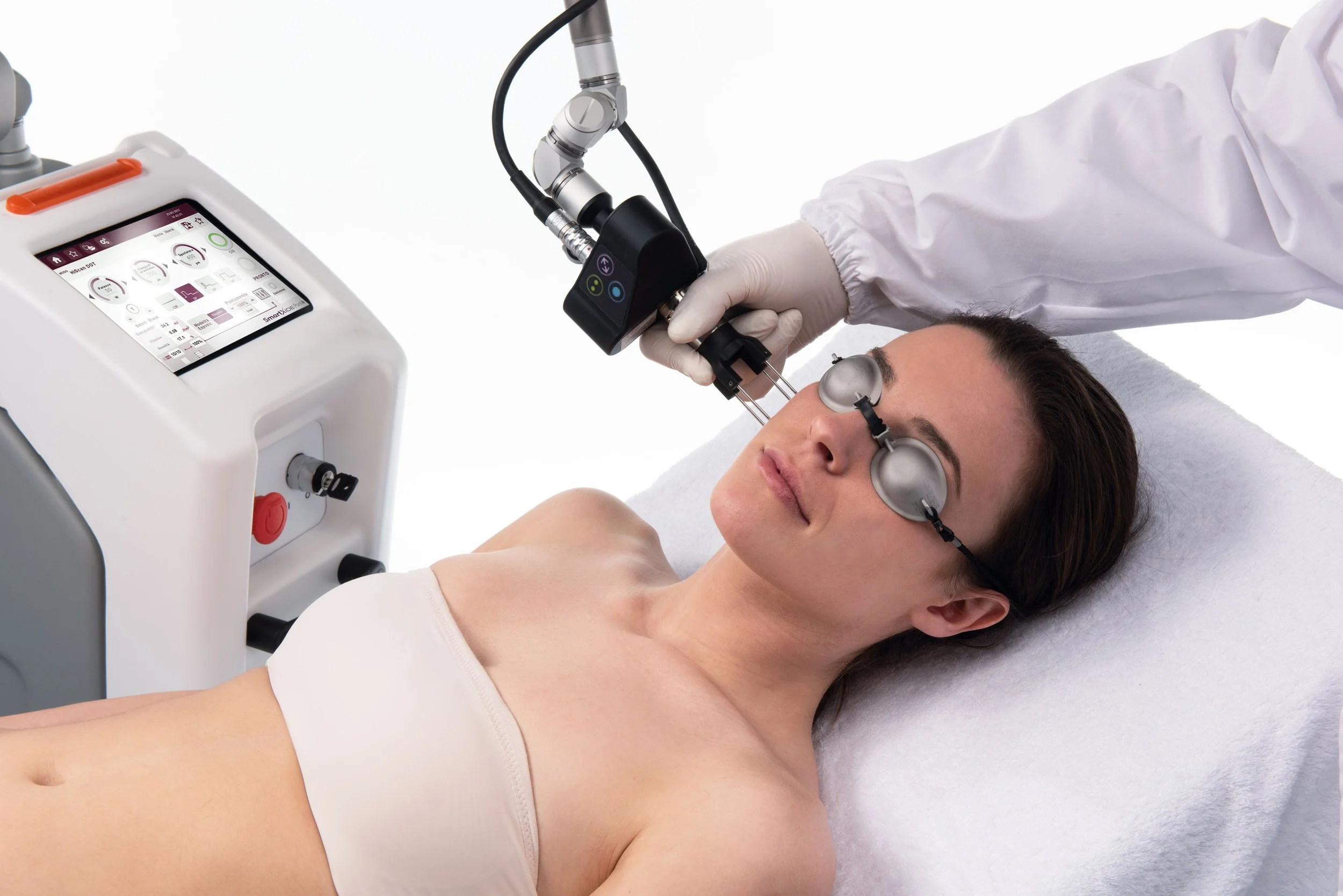 Practitioner performing fractional CO2 laser treatment with a CO2 laser machine at ATSCI training